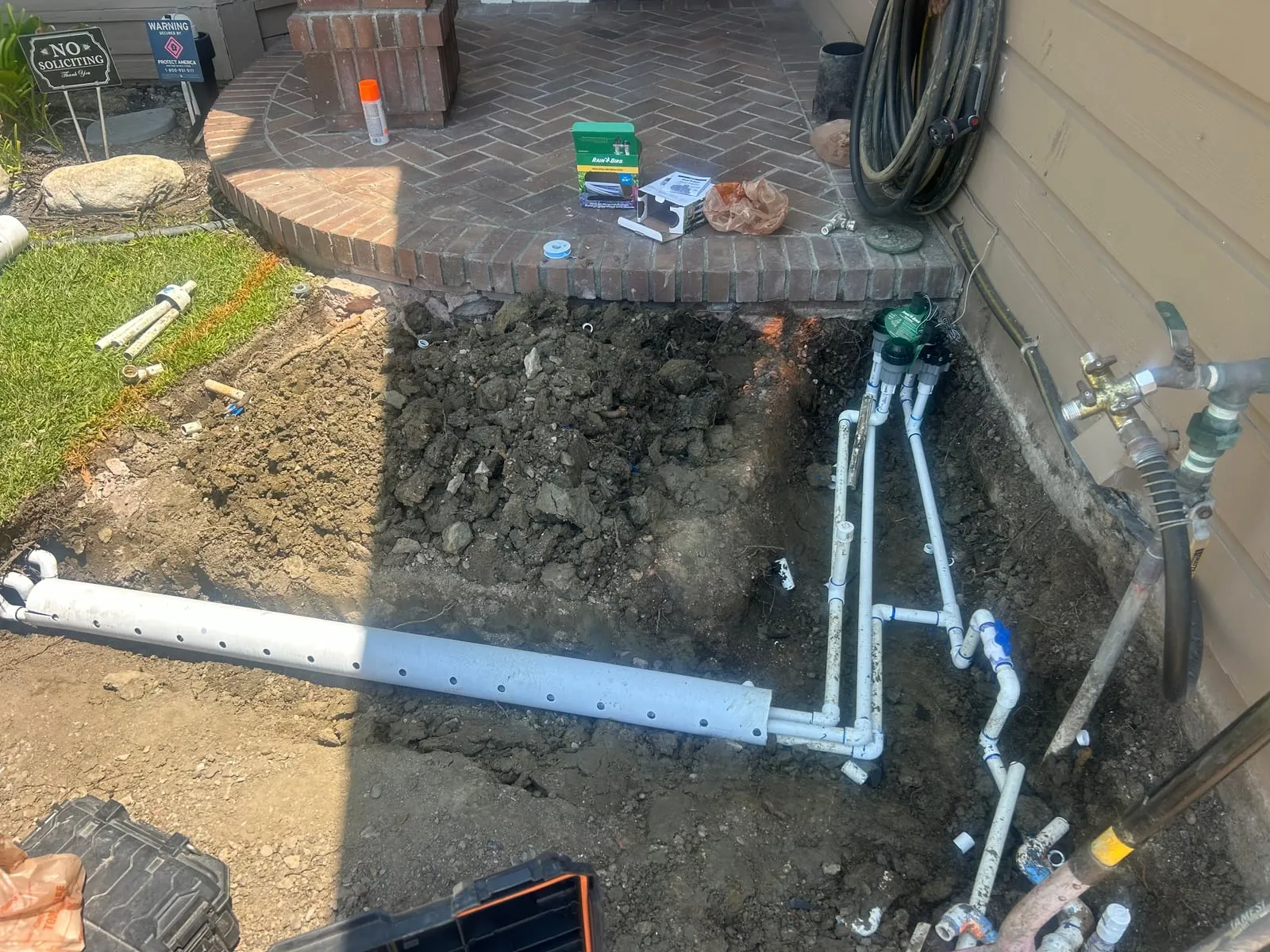 New irrigation manifold and valves plumbed at the side of a house